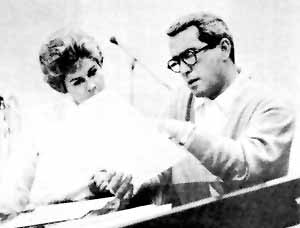 ~ Arranger Anita Kerr and Perry go over some music.